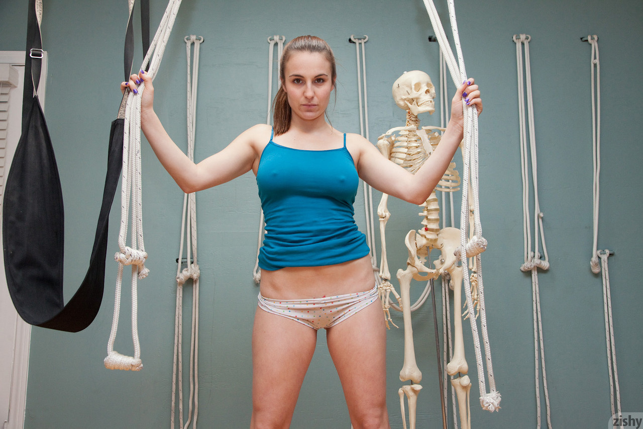 Playful teen Nina Gitch poses braless in sexy top & panties next to a skeleton foto porno #428495444