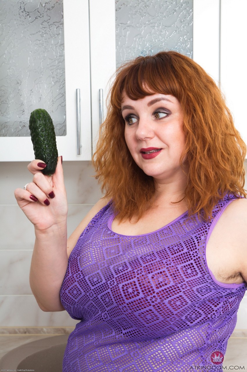 Chubby wife Katrin Porto plays with a cucumber after revealing her hairy twat porn photo #424809671