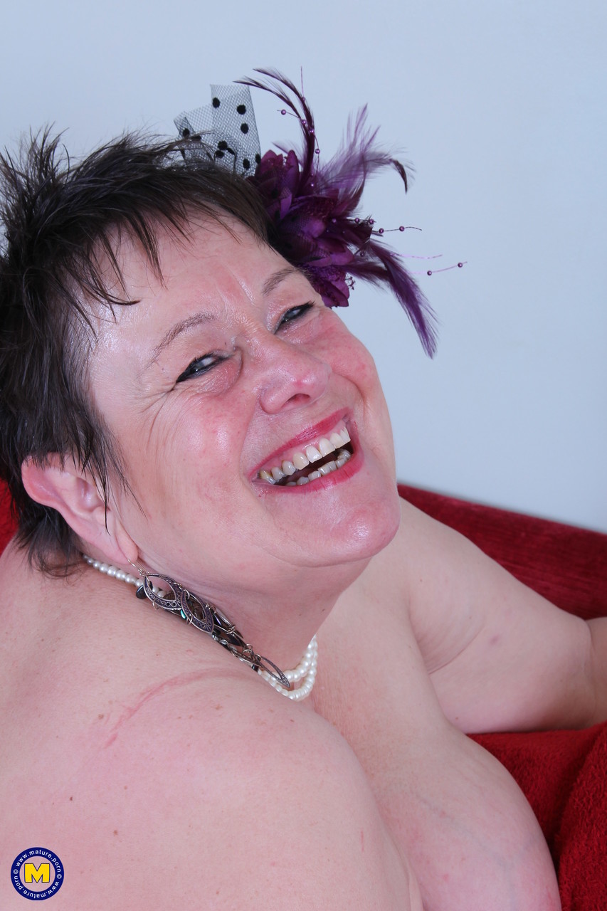 The BBW Honey, with short hair, exposed her large breasts and displayed an older body in the act.