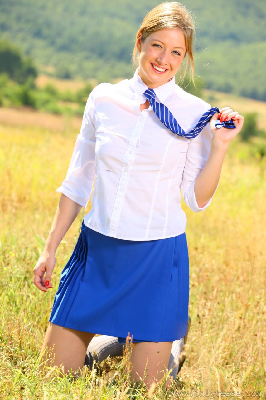 Cutie in school uniform Nikki F strips and goes topless outdoors foto porno #425534807