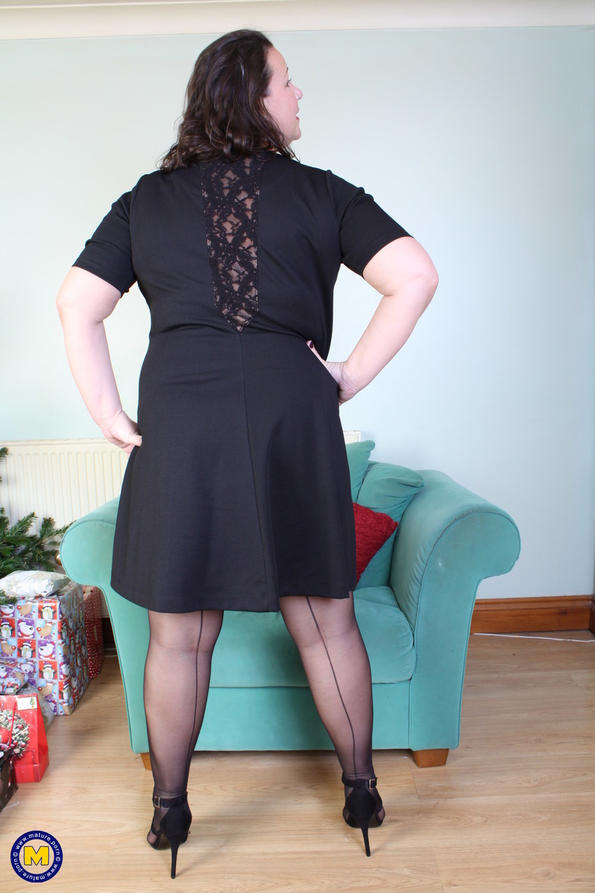 Brunette mom Eva Jayne removes her black dress and flaunts her curves porn photo #424543977