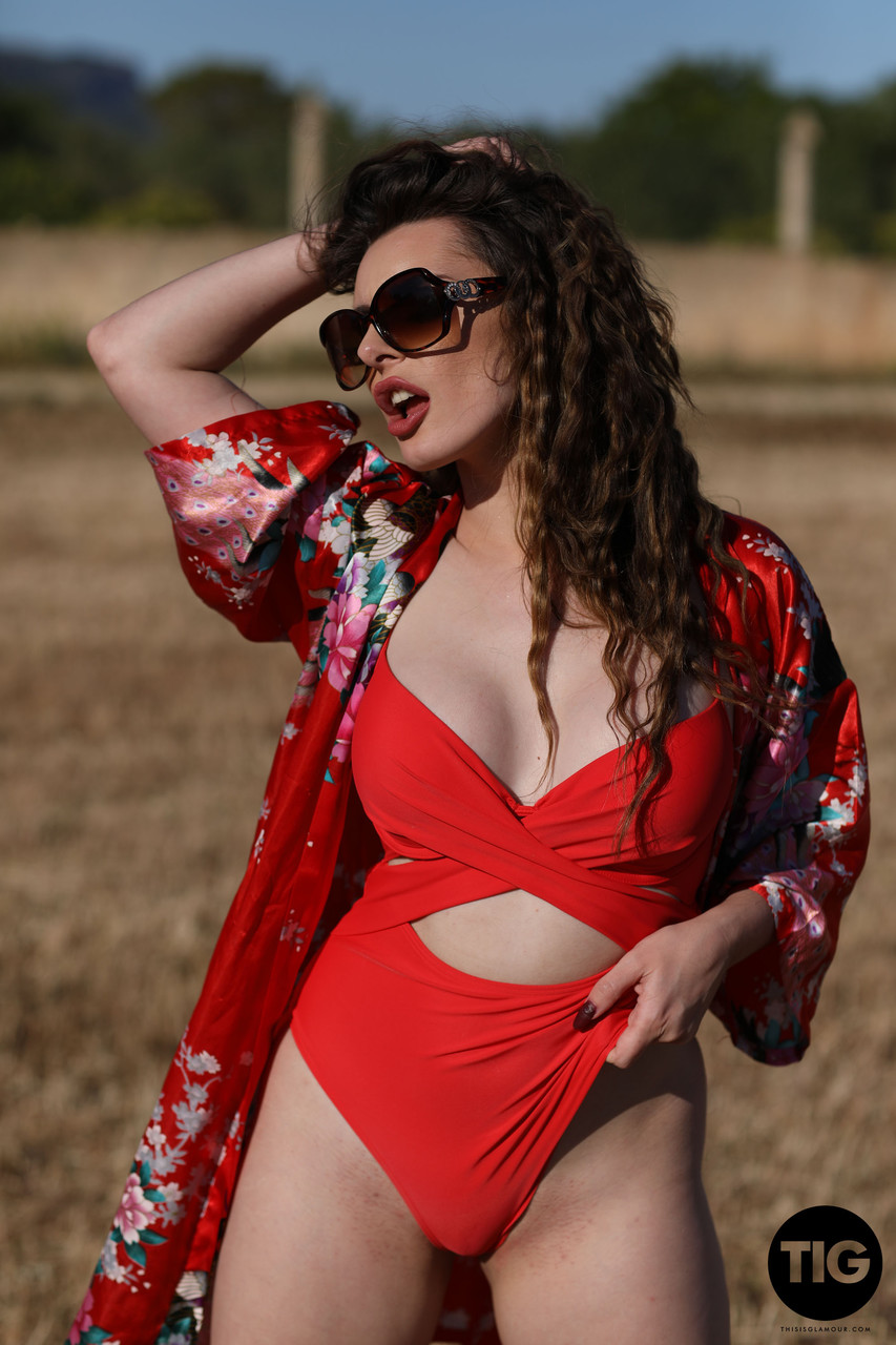 Curly haired babe Valis Volkova removes her red bikini and poses outdoors ポルノ写真 #425558425