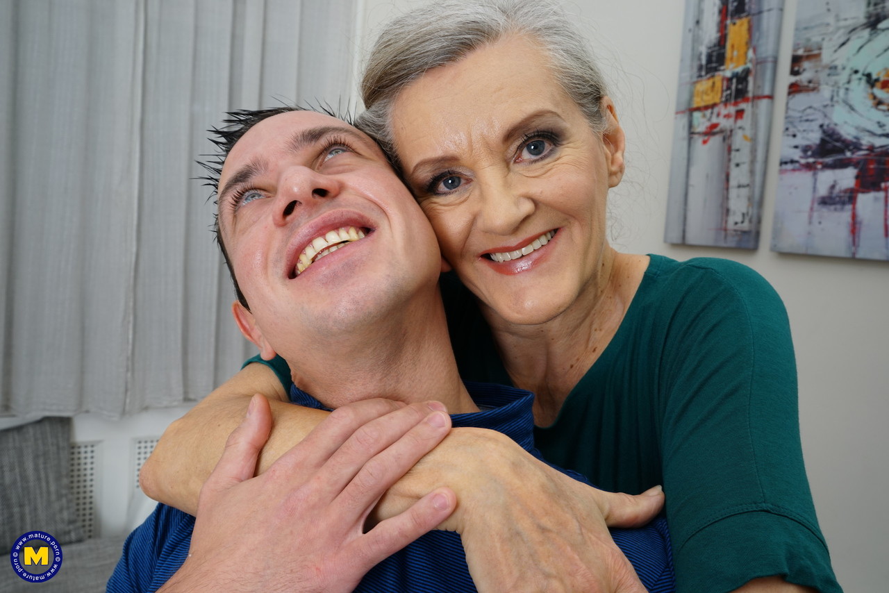 Horny granny Birgitta K receives a strong applause from her young neighbor.
