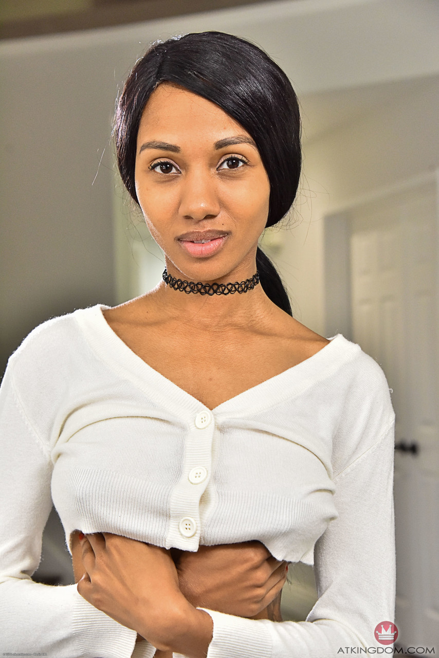 Petite ebony Alexis Avery exposes her naturals and brown nips in a solo.