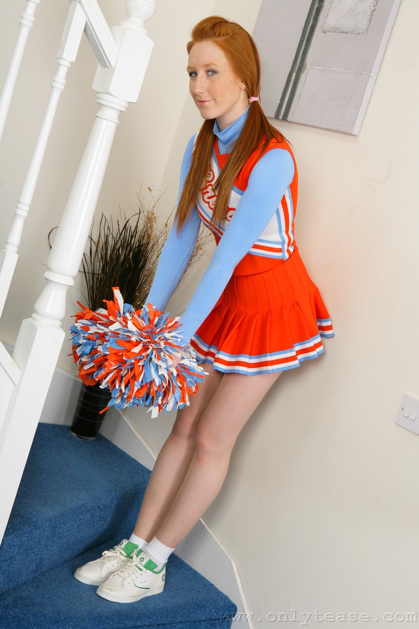 Natural redhead Jade Victoria doffs a cheerleader uniform to get naked porn photo #424456290