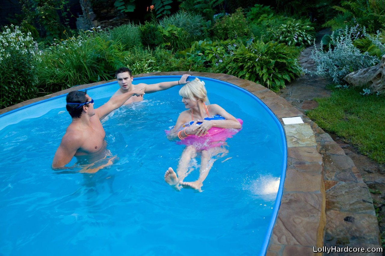 Petite blonde teen gets spit roasted in a threesome after a pool party foto porno #428296025