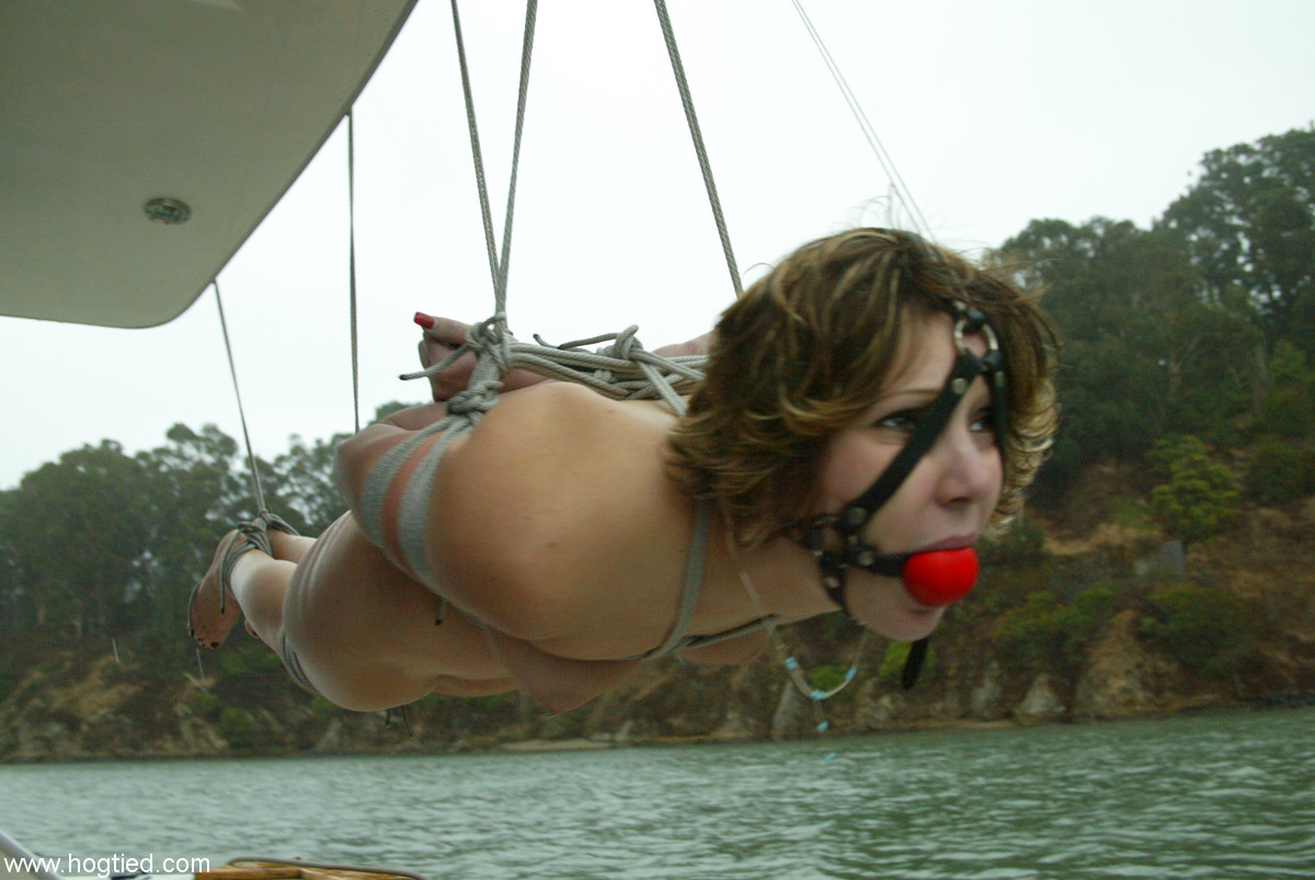 Kinky teen with a natural ass Kat gets tied up and tortured on a boat порно фото #428711226