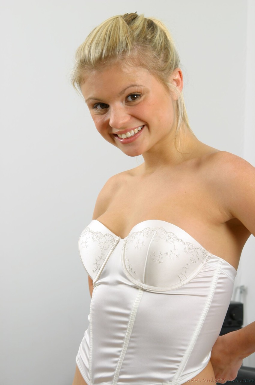 Slutty nurse Jak doffs her uniform to show her sweet tits in white stockings porn photo #424022706