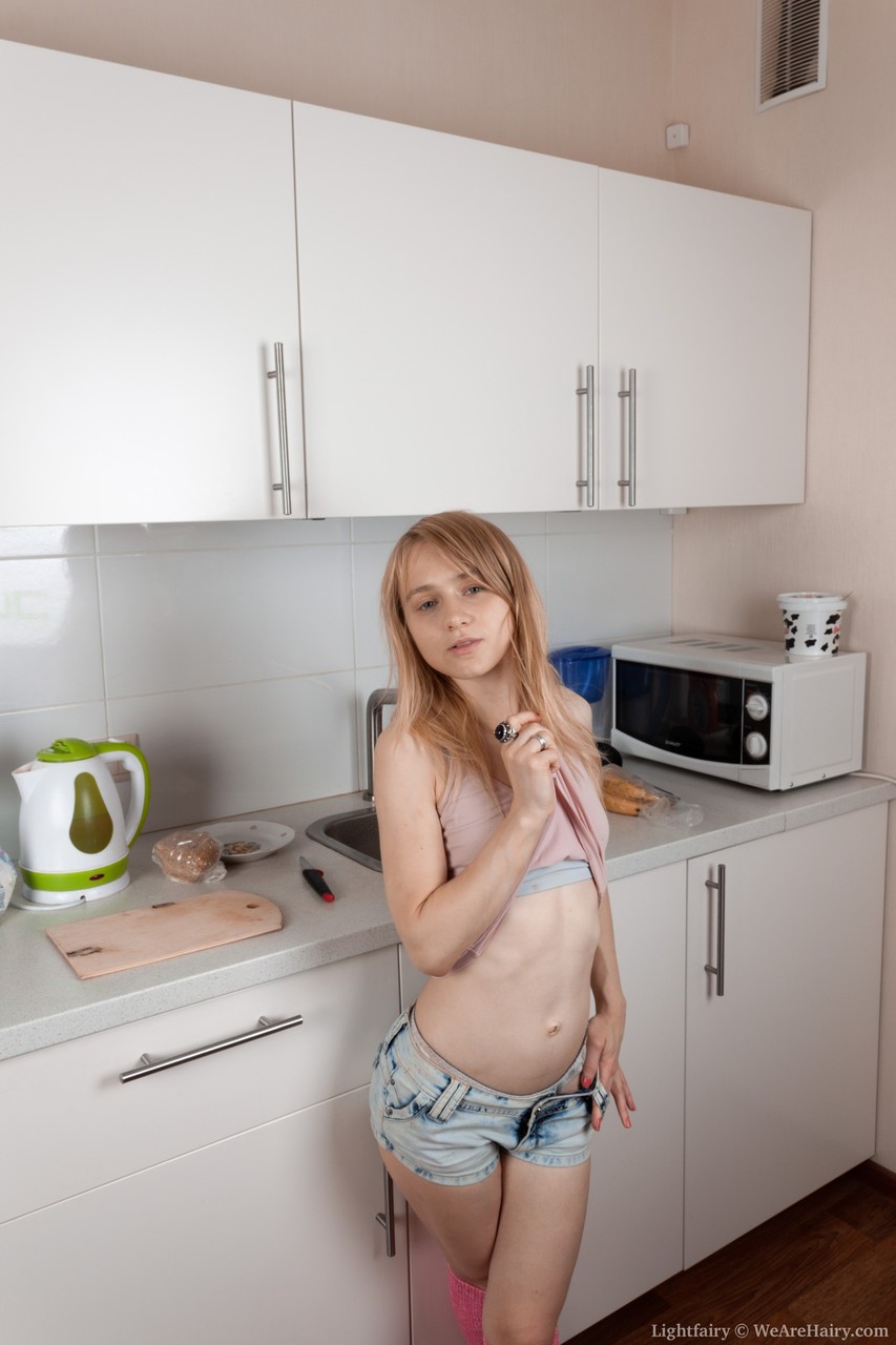 Little seductress Lightfairy strips in the kitchen & shows her furry muff foto porno #428578328