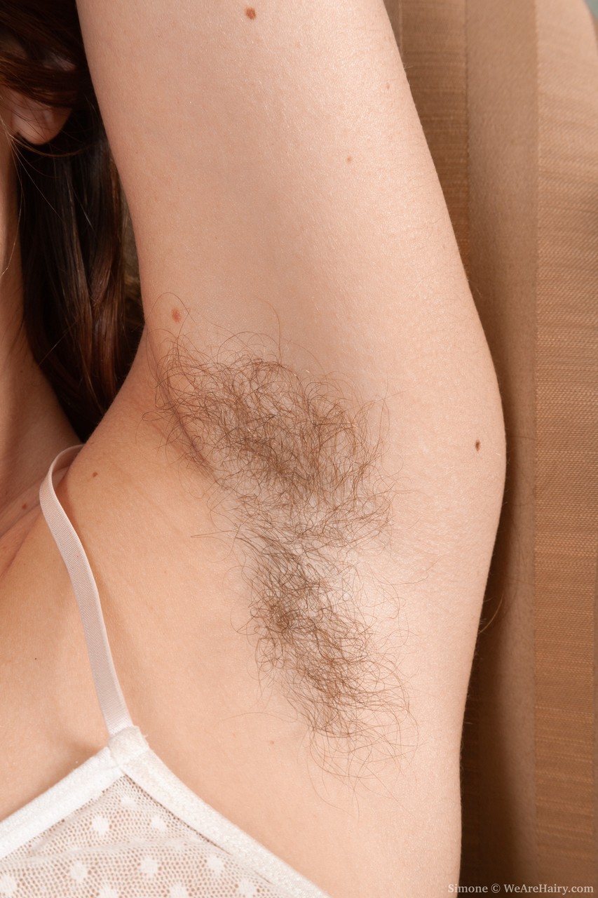 The beautiful hair of Simone, the model, is accentuated by her unshaven legs and fuzzy clitch.