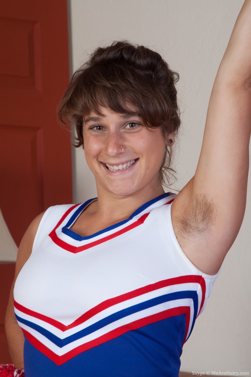 Nasty cheerleader Sayge poses in the bedroom and shows her muff porn photo #422792038