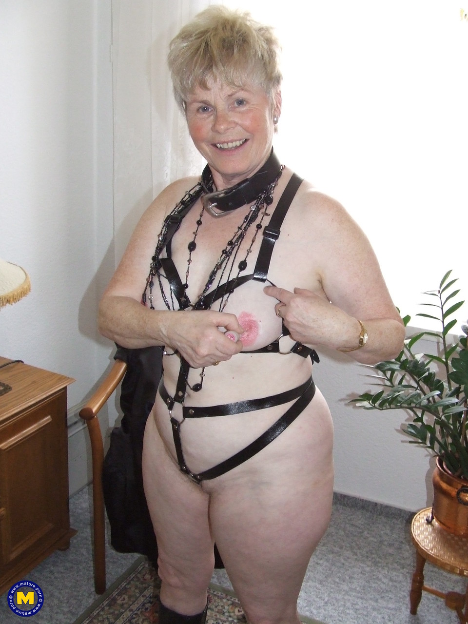 Older BBW with short spiky hair takes off lingerie and fetish gear to go nude porn photo #423878676