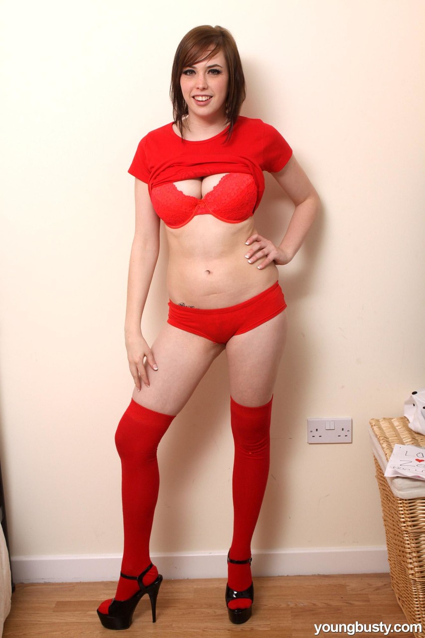 Irresistible teen Louisa wears sexy red stockings while showing her big tits