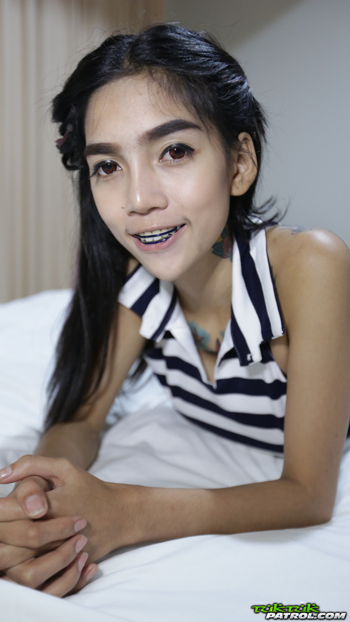 Skinny Thai Girl With Tattoos And Braces Makes Her Nude Modelling Debut