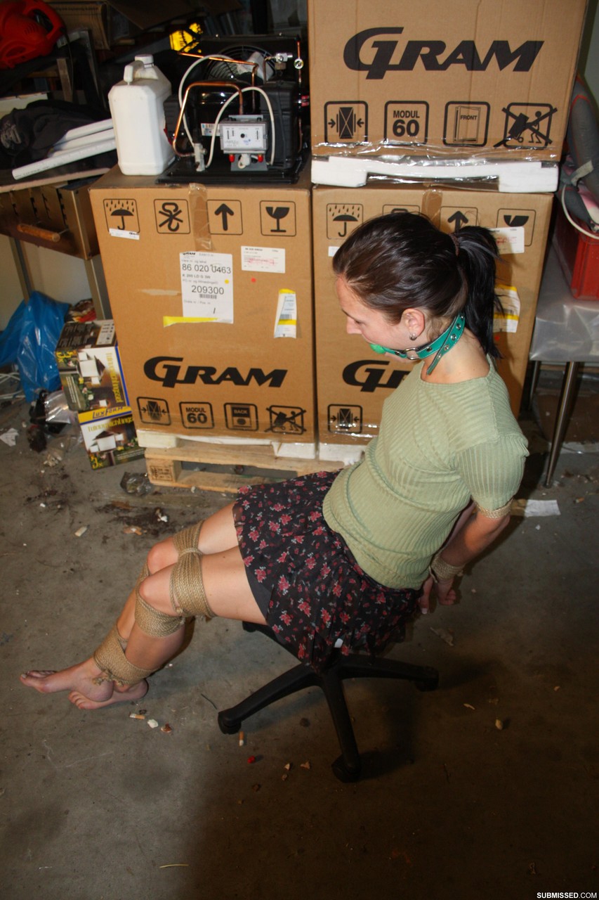 Clothed female is left alone in a chair after being ball gagged and tied up porn photo #426916751