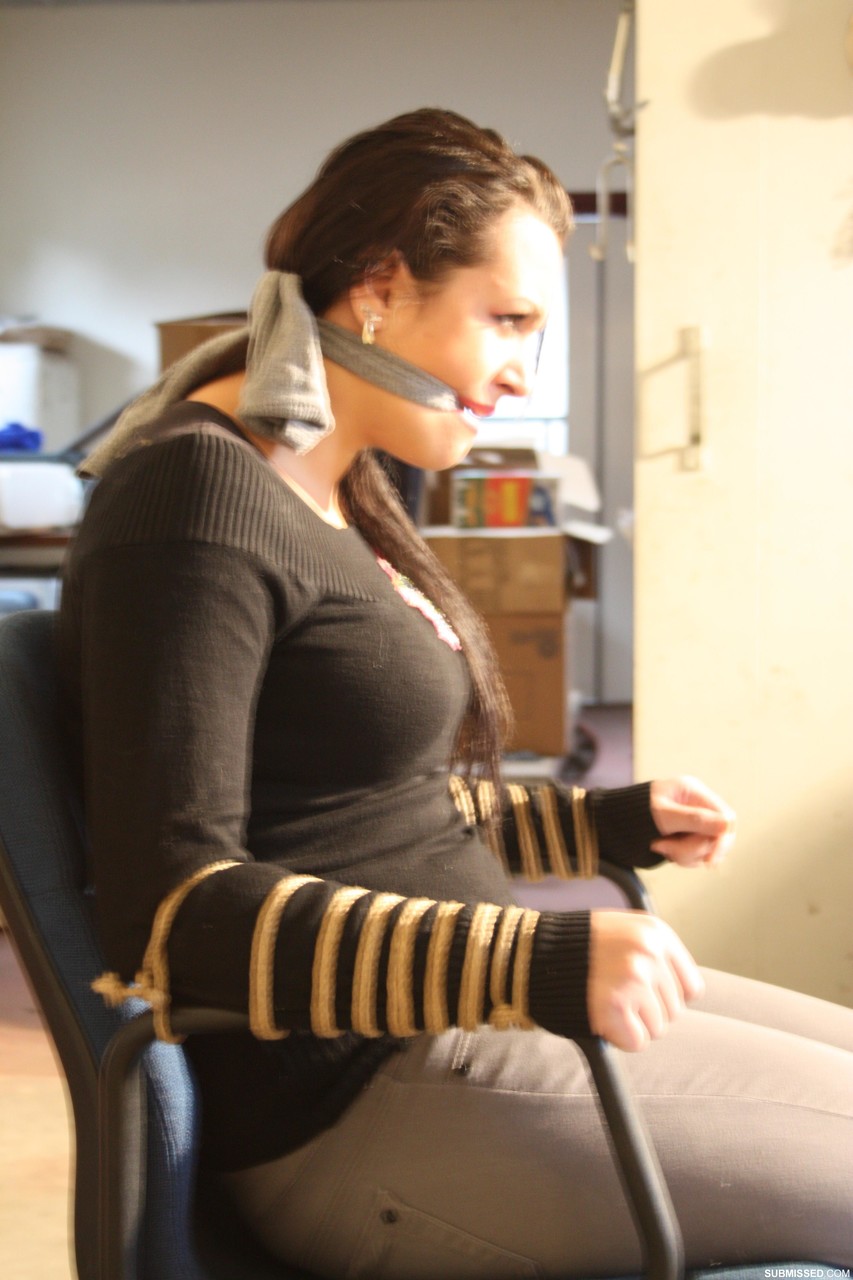 Clothed female struggles against her restraints and mouth gag in a chair photo porno #428284665