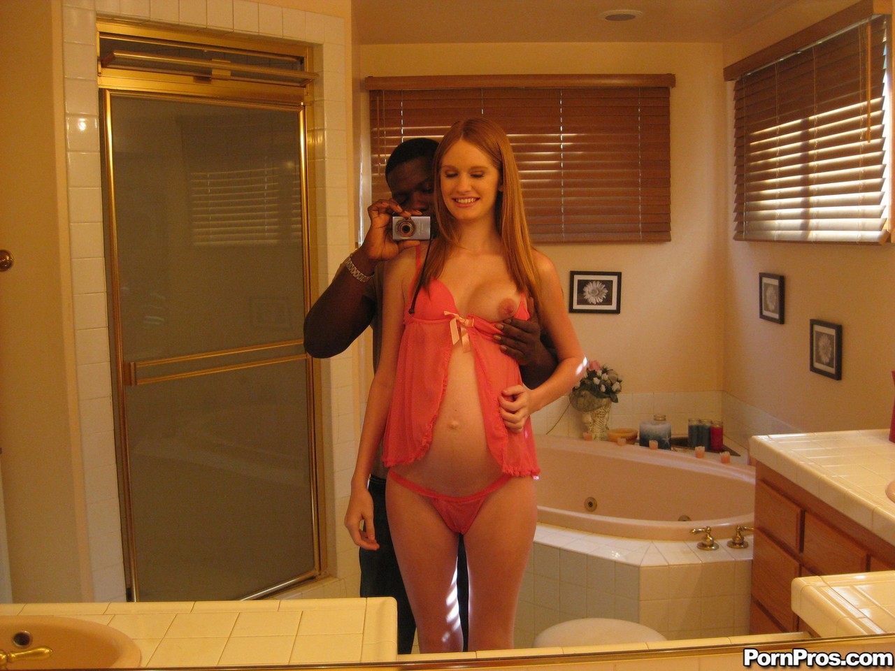 Pregnant redhead Layla Exx poses for the photoshoot with black guy porn photo #428844083