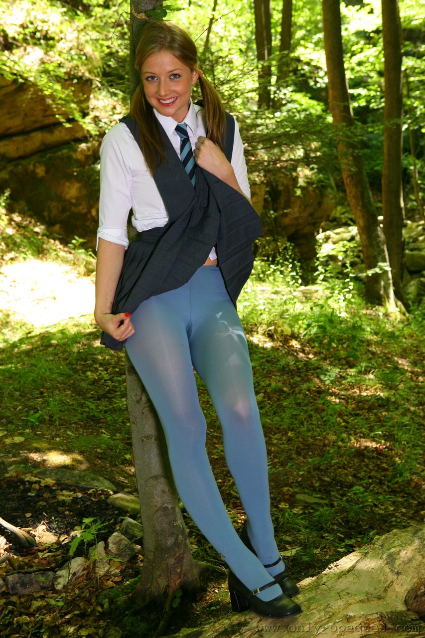 Horny schoolgirl Maddie M stripping to her blue pantyhose in the woods foto porno #426717216