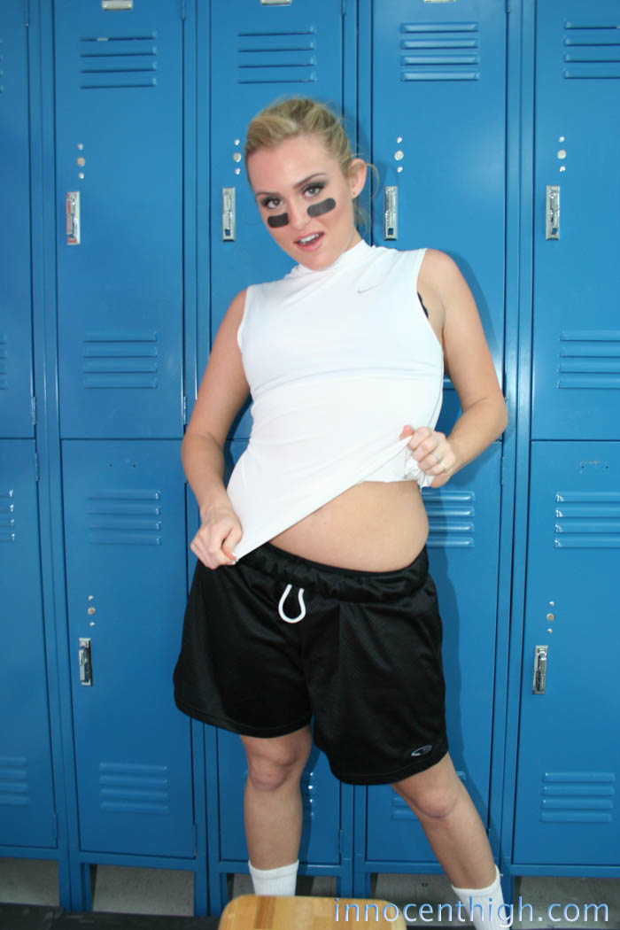 Cute footballer Ruby Ryder strips her uniform to pose nude in the locker room foto porno #425010637