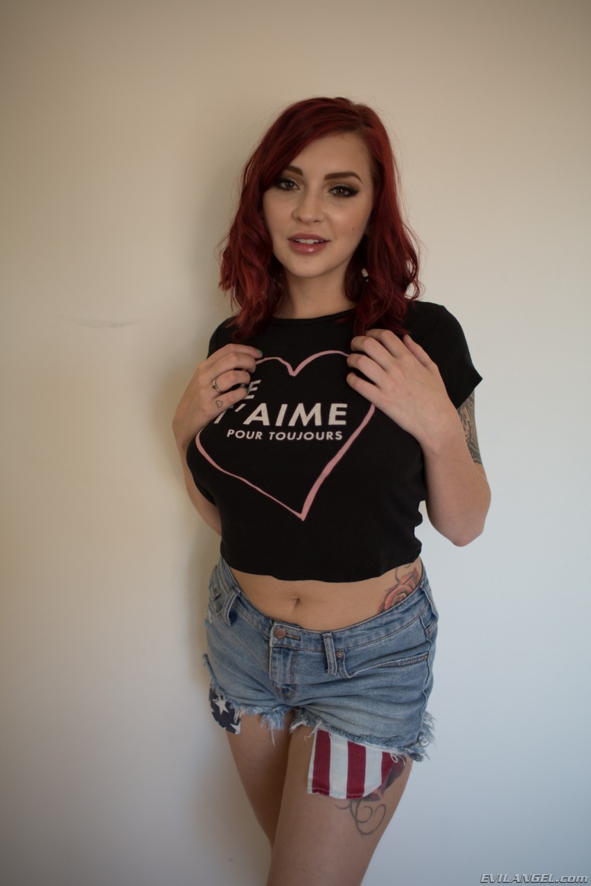 Redhead babe Amber Ivy bares her natural tits and takes off her tight shorts порно фото #425433299