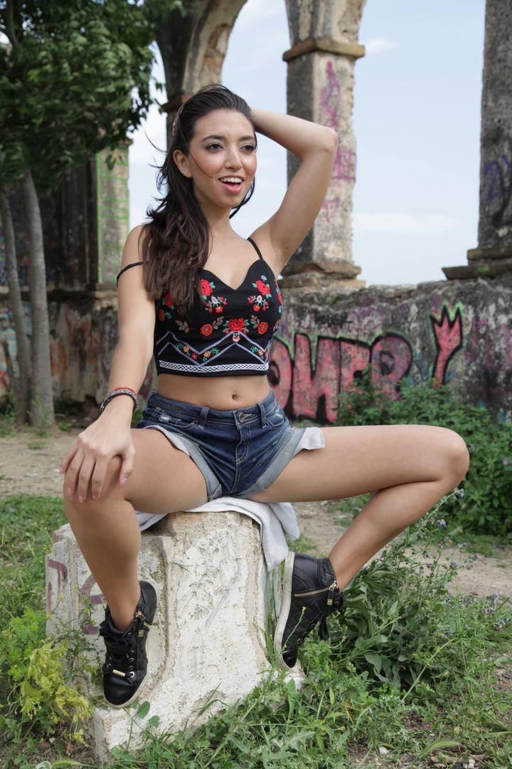 Brunette Latina Frida Sante strips naked in the ruins showing nice medium tits порно фото #427991477