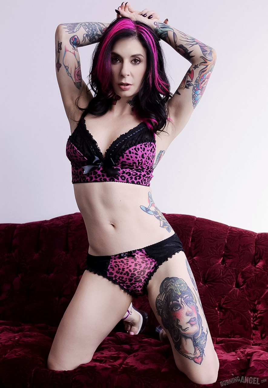 Fuchsia haired Joanna Angel peels sexy lingerie to pose on the sofa in heels порно фото #427039916