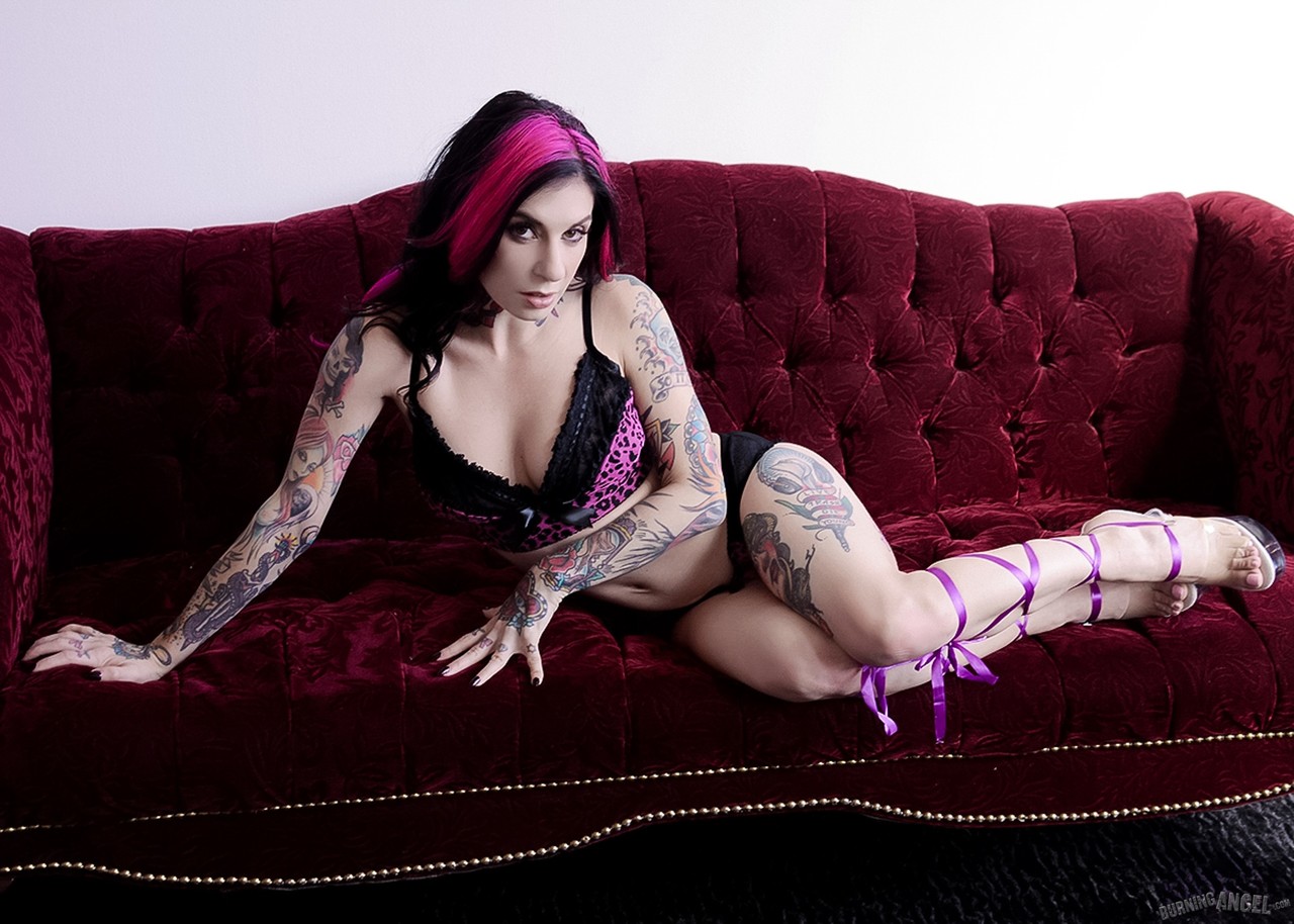 Fuchsia haired Joanna Angel peels sexy lingerie to pose on the sofa in heels ポルノ写真 #427039919
