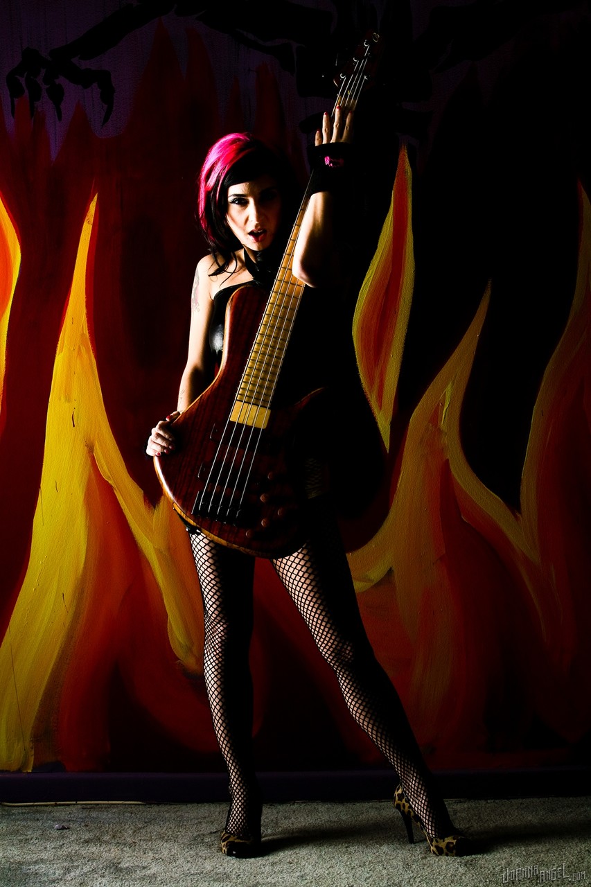 Gorgeous goth Joanna Angel poses with bass guitars topless in ripped fishnets photo porno #427067082