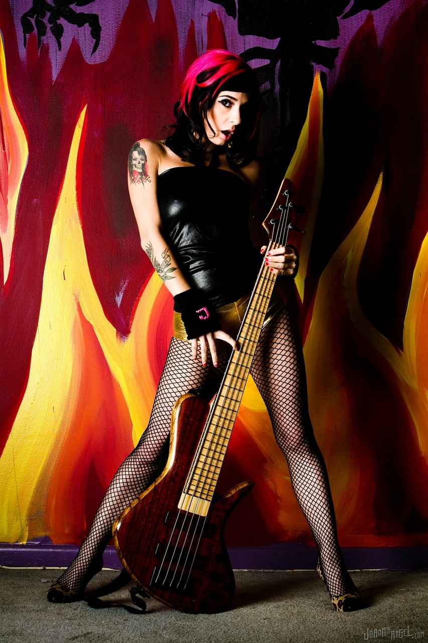 Gorgeous goth Joanna Angel poses with bass guitars topless in ripped fishnets foto pornográfica #427067084