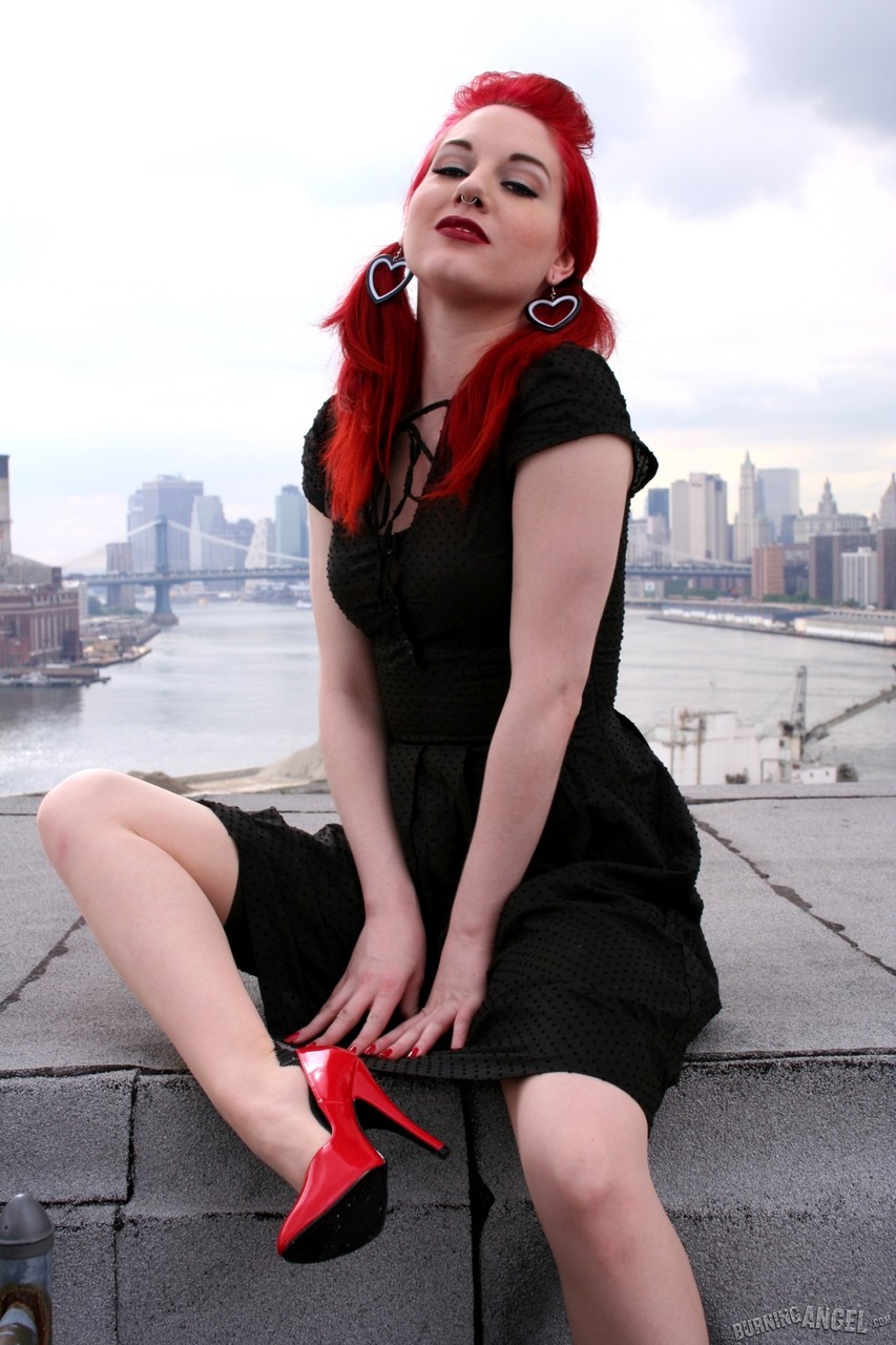 Redheaded model strips to back seam nylons and heels on a rooftop porno foto #422856826