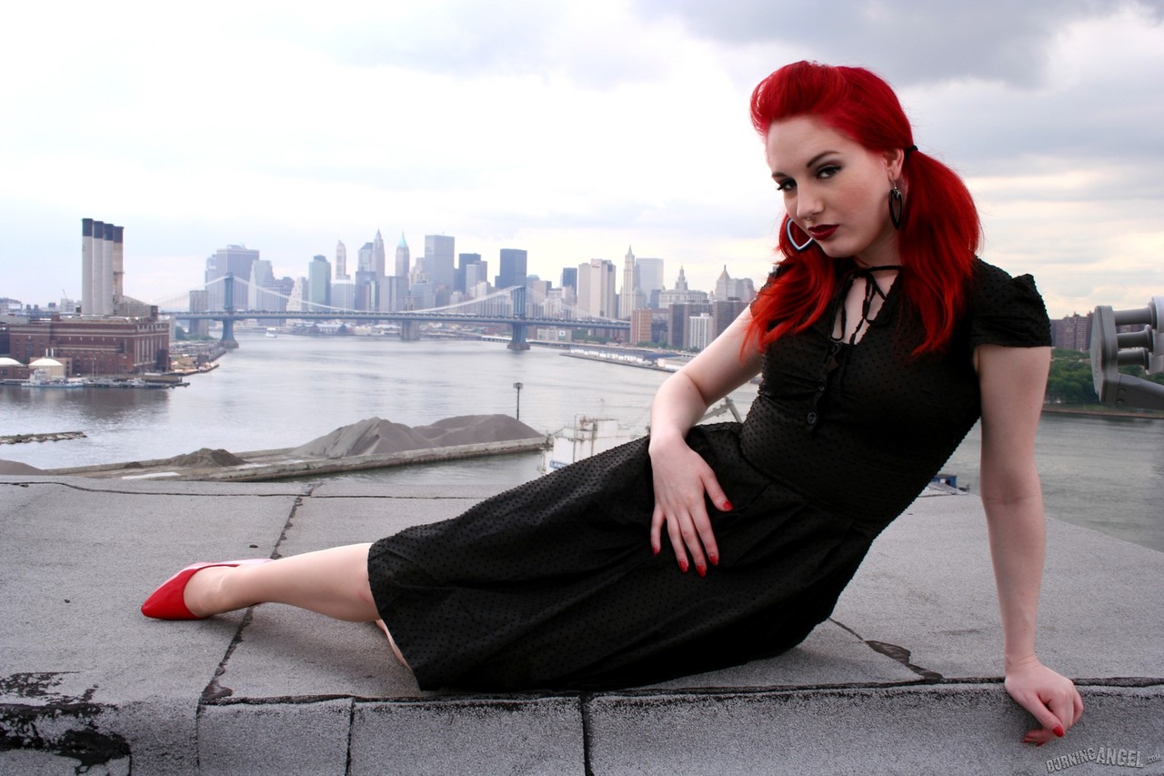 Redheaded model strips to back seam nylons and heels on a rooftop porn photo #423441983