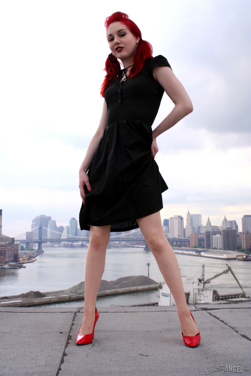 Redheaded model strips to back seam nylons and heels on a rooftop porno foto #423442000