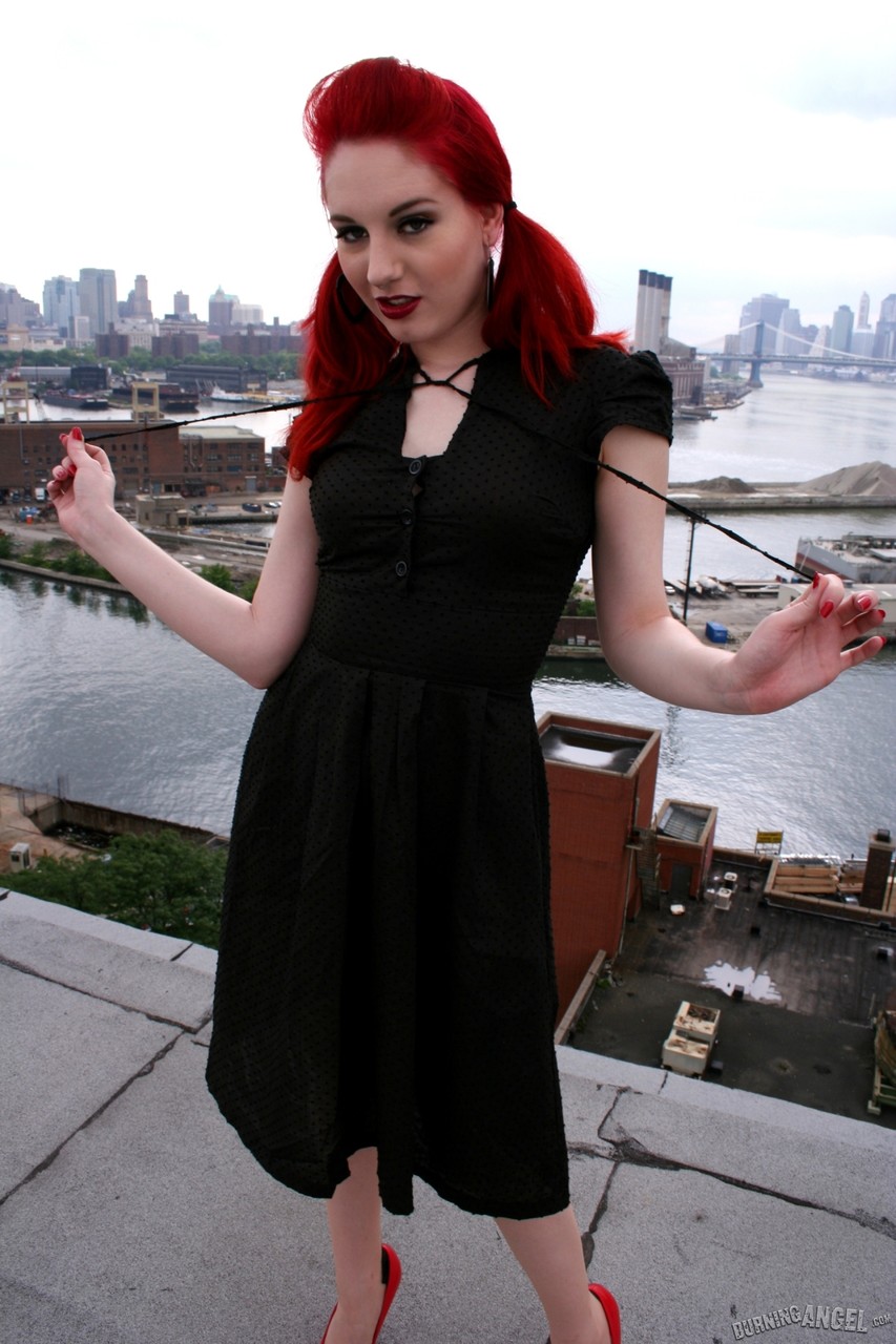 Redheaded model strips to back seam nylons and heels on a rooftop porn photo #423442055