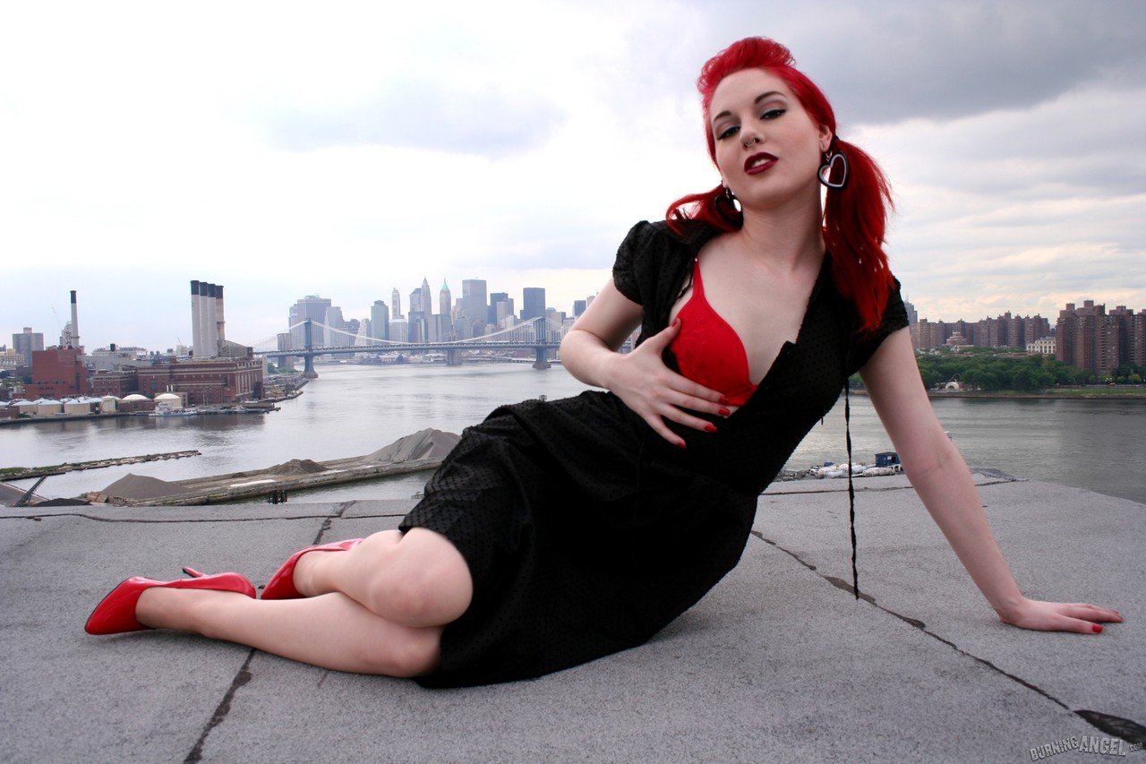 Redheaded model strips to back seam nylons and heels on a rooftop porno foto #423442085