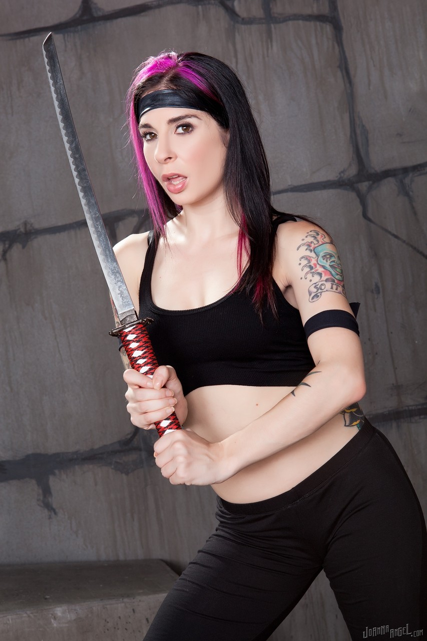 Tattooed Ninja with dyed hair holds a Samurai sword while disrobing foto porno #427890145