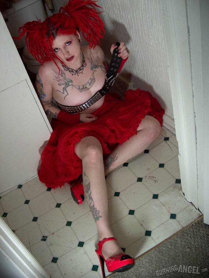 Fetish chick with flaming red hair spreads her chubby pussy wide in bathroom porn photo #427861643