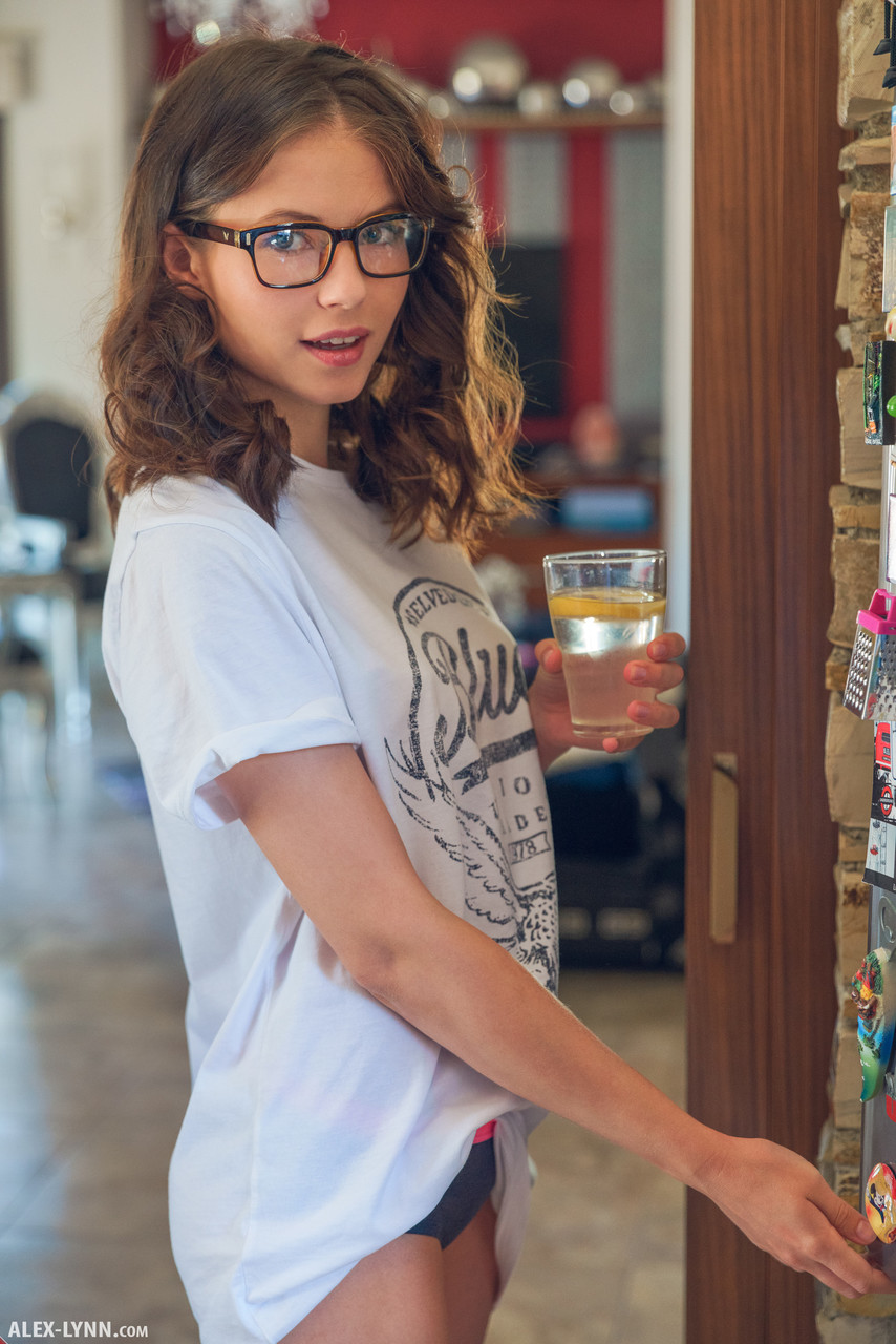 Teen with glasses Hilary gets nude in the kitchen to enjoy her lemon water porno foto #427037431