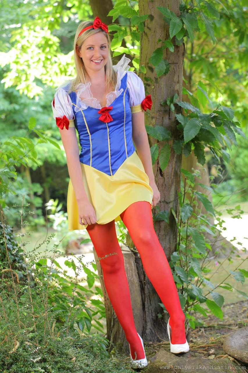 Sweet girl in Snow White costume Nikki F poses topless in red nylons outdoors foto porno #423184854