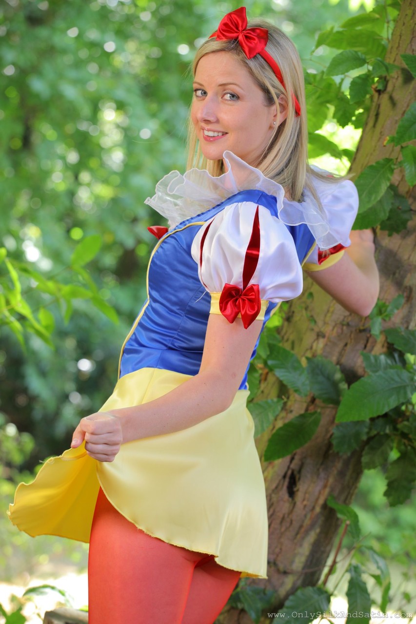 Sweet girl in Snow White costume Nikki F poses topless in red nylons outdoors foto porno #423184860