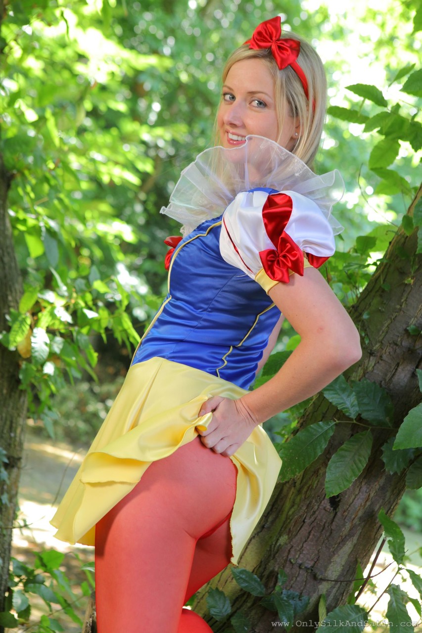 Sweet girl in Snow White costume Nikki F poses topless in red nylons outdoors porn photo #423184875