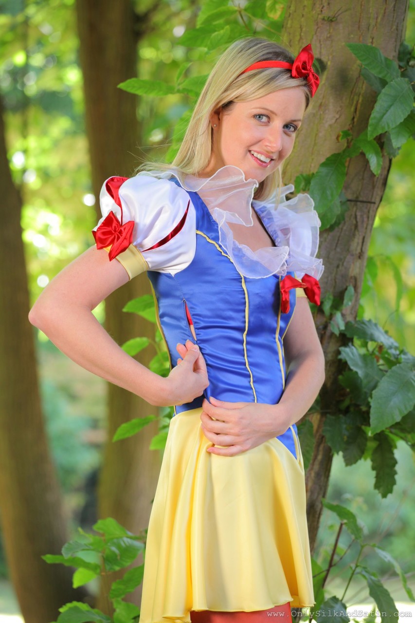 Sweet girl in Snow White costume Nikki F poses topless in red nylons outdoors porn photo #423184877