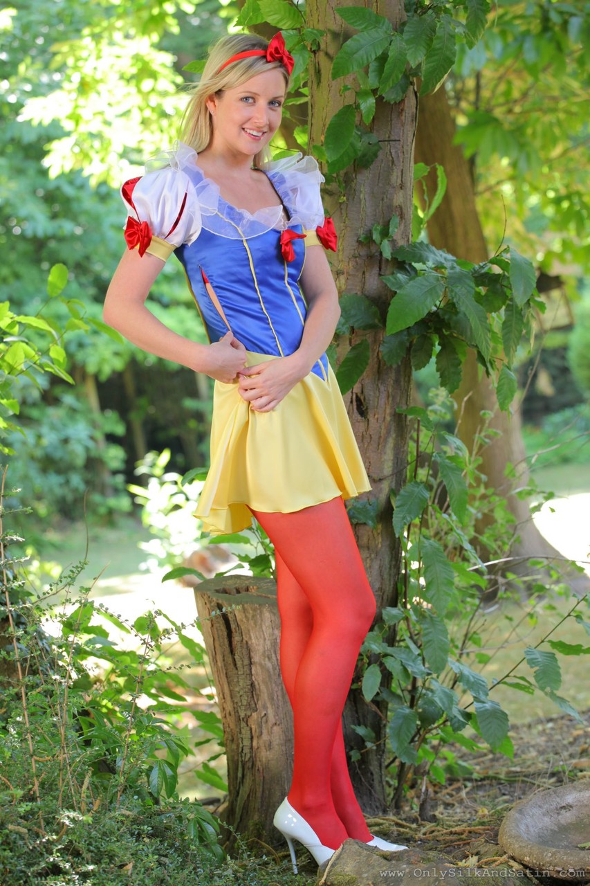 Sweet girl in Snow White costume Nikki F poses topless in red nylons outdoors porn photo #423184879