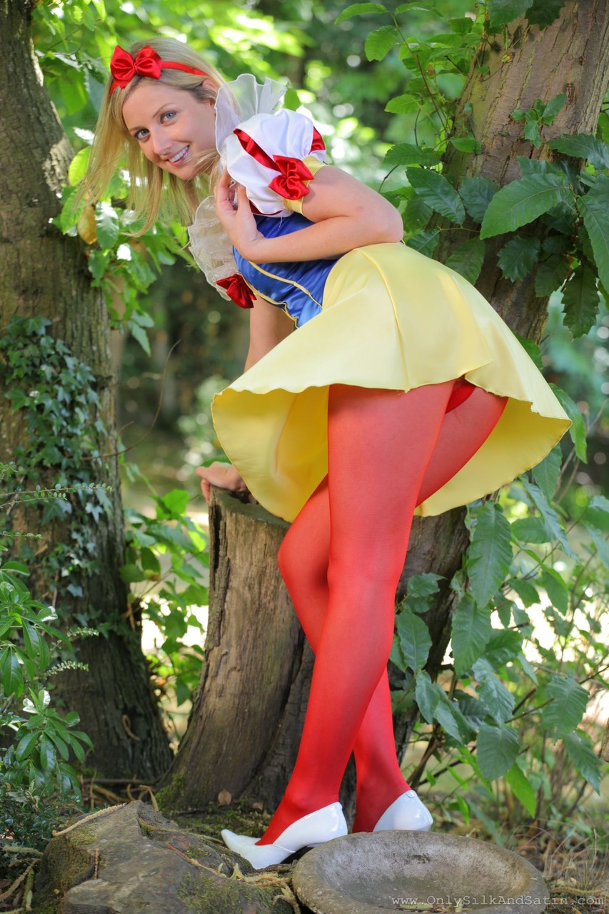 Sweet girl in Snow White costume Nikki F poses topless in red nylons outdoors porn photo #423184881