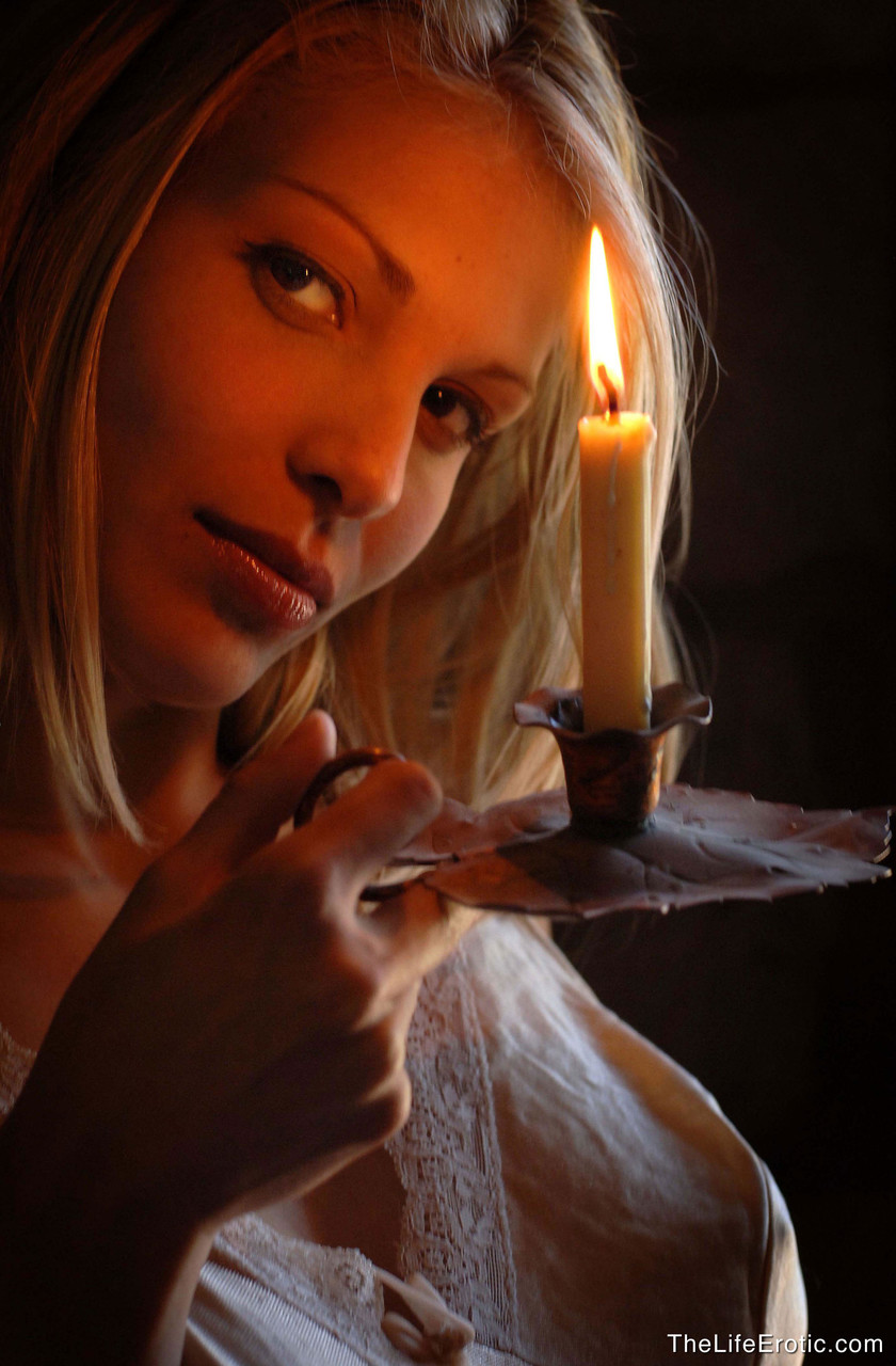 Hot blonde girl hold a lit candle to her great nipples during nude poses foto porno #427156091