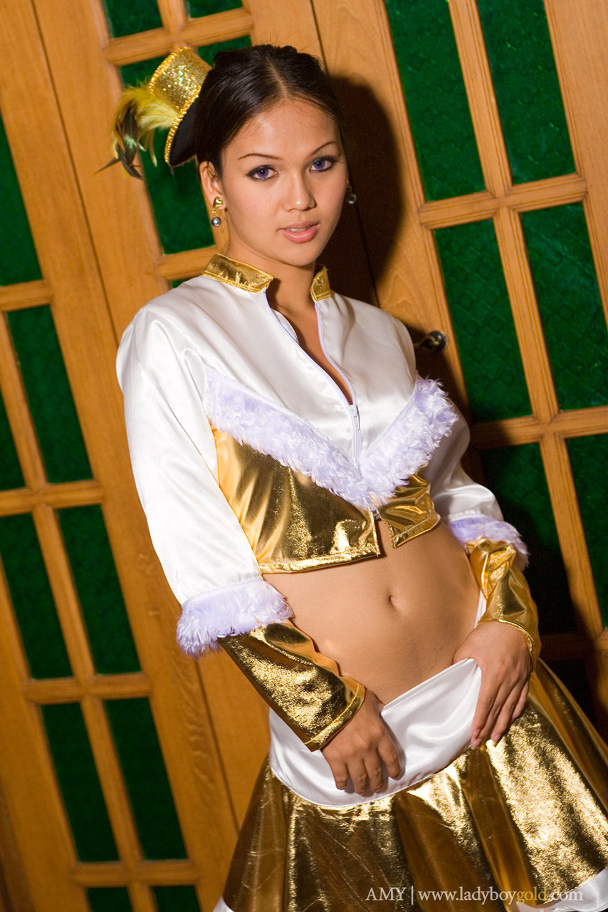 Asian Shemale Amy Undresses Golden Outfit And Teases With Ass And Tits