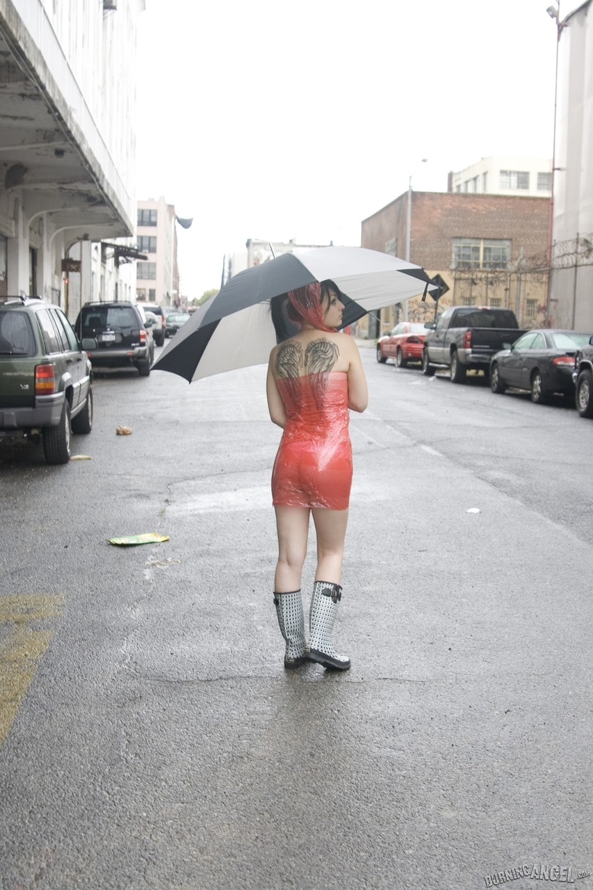 Totally wet pierced teen gets her latex dress off on a rainy day porn photo #428775722