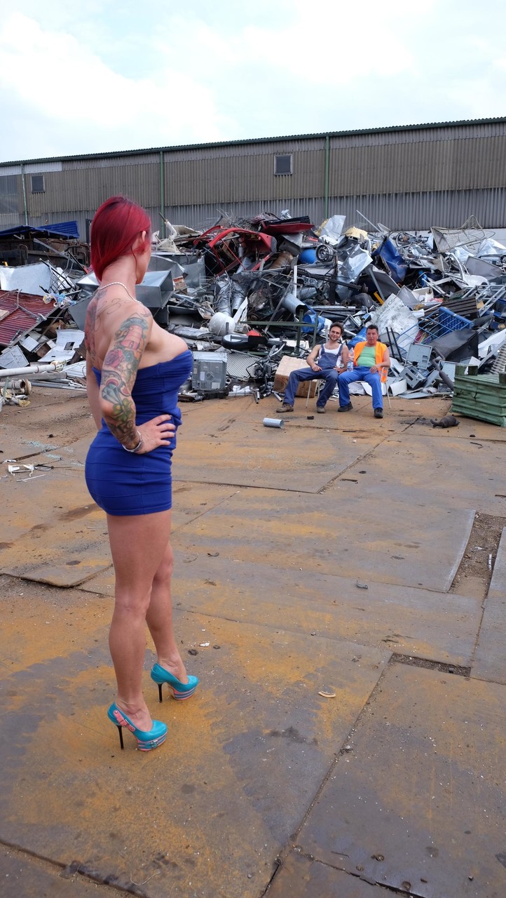 Redhead MILF with tattoos and fake tits gets banged in a junk yard 3some порно фото #428323960