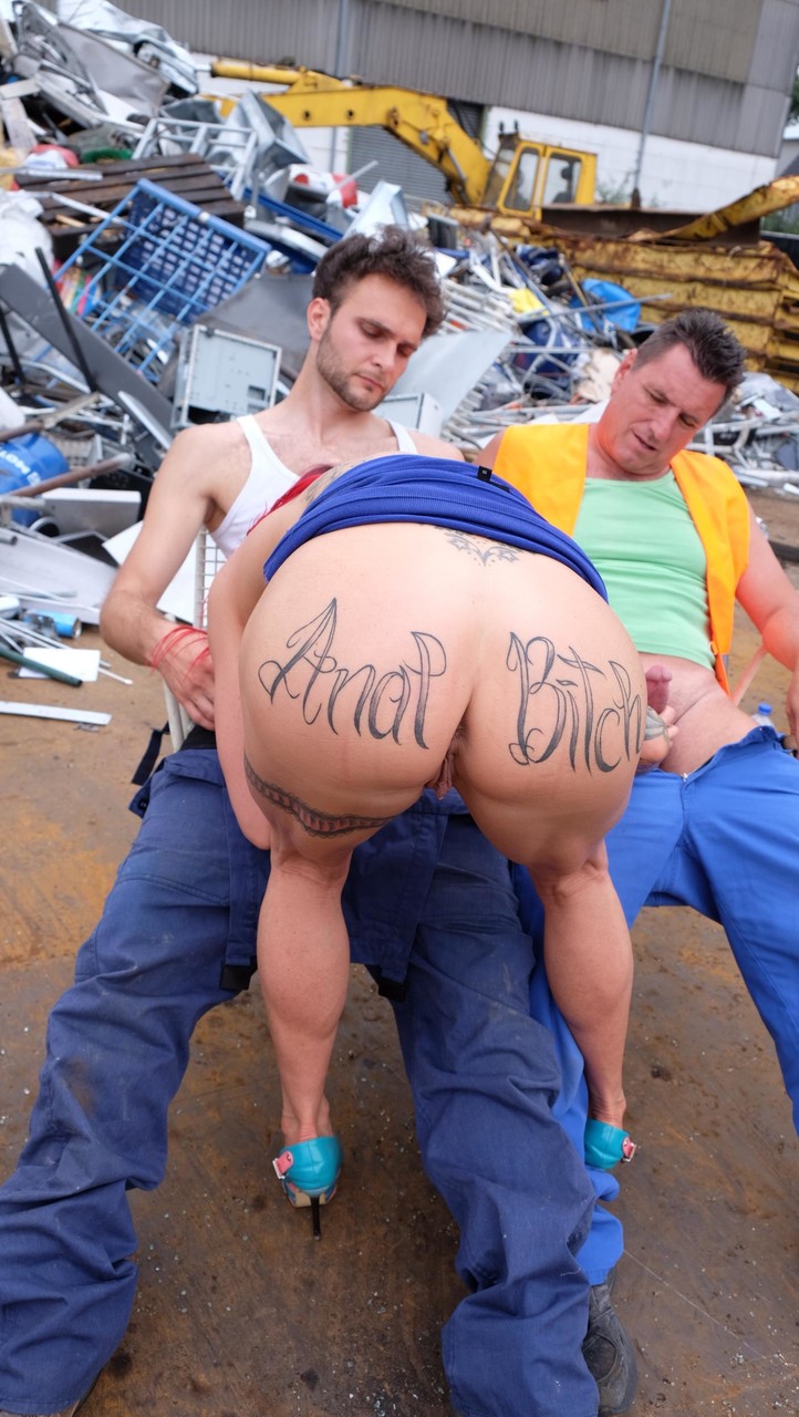 Redhead MILF with tattoos and fake tits gets banged in a junk yard 3some ポルノ写真 #428323981