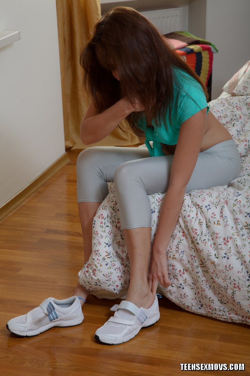 On a bed, Valentina C's tender legs are covered in hot tights and she rides on warm henna.