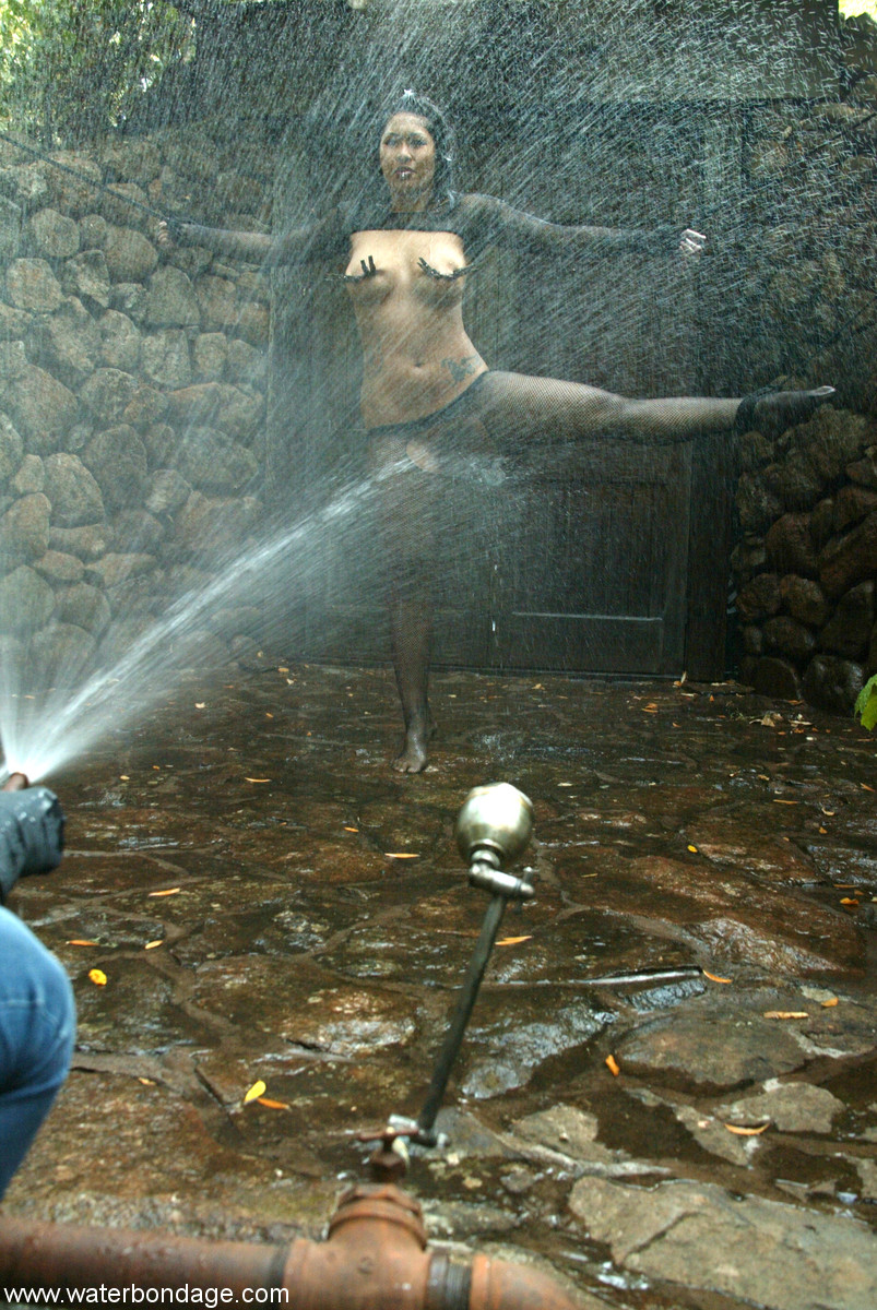 Slave in black pantyhose DragonLily endures in outdoor bondage water torture porn photo #427843341